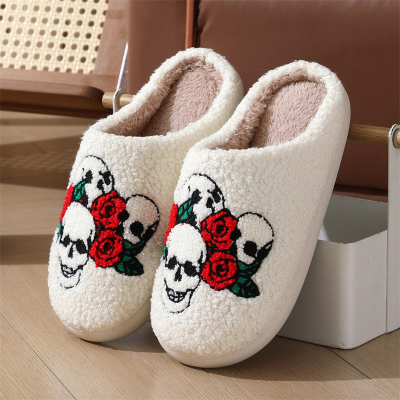 Chaussons en peluche tête de mort rose