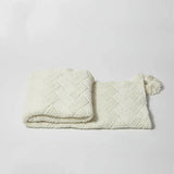 Couverture en chenille tricotée à la main avec des pompons